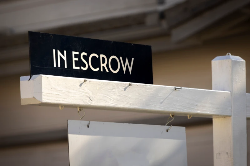 home in escrow sign