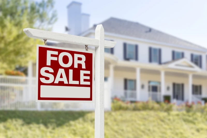 Home for sale with real estate sign