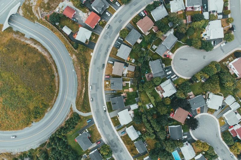 Aerial view of a suburban neighborhood with curved roads